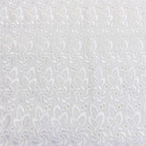 Channel White Color—Eyelet Floral Embroidery Fabric— 100% Polyester—Width 57/58 Inches Wide—Sold by the Yard — Nationwide Shipping Available.